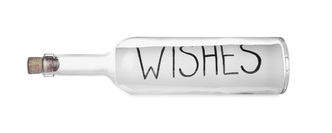 Photo of Corked glass bottle with Wishes note on white background