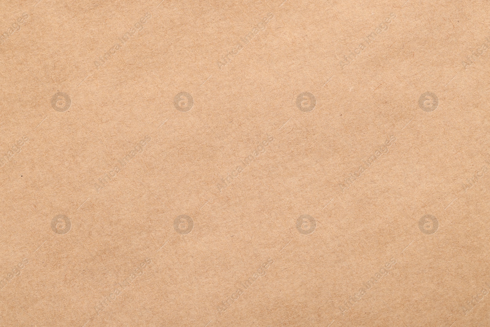 Photo of Texture of beige paper sheet as background, top view