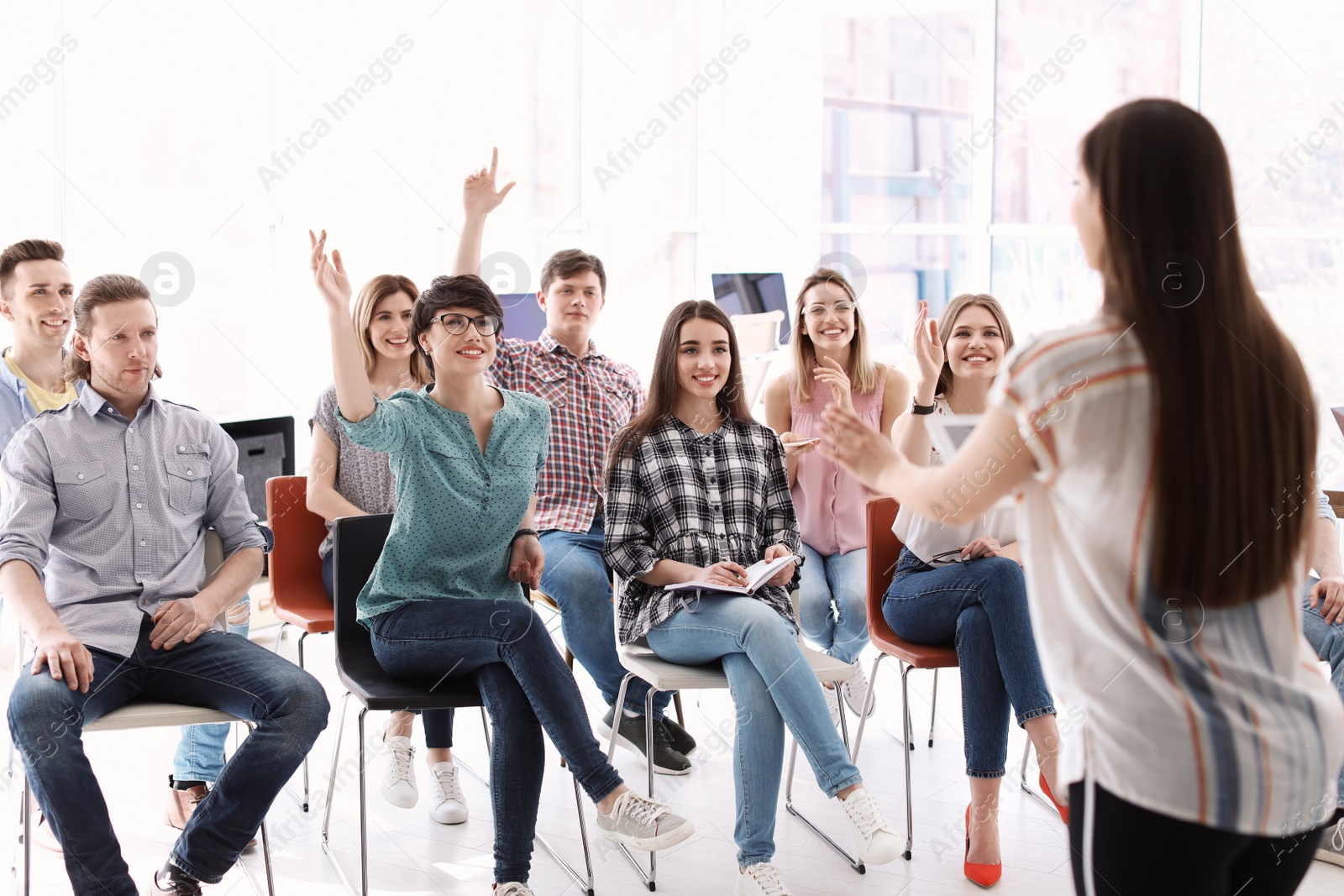 Photo of Female business trainer giving lecture in office