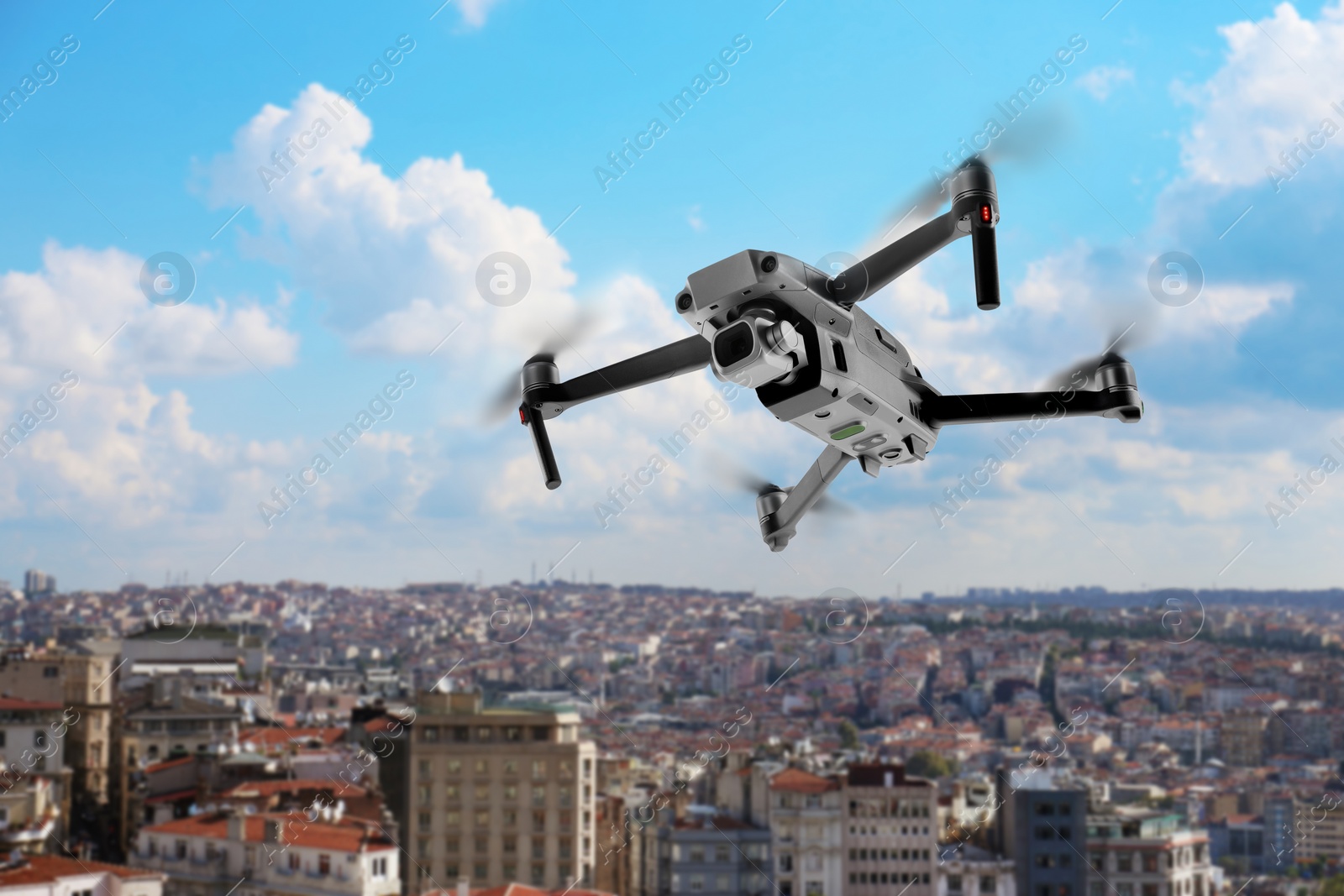 Image of Modern drone flying over city. Aerial survey