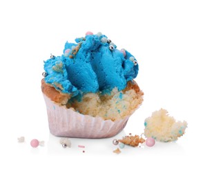 Photo of Failed cupcake with cream on white background. Troubles happen