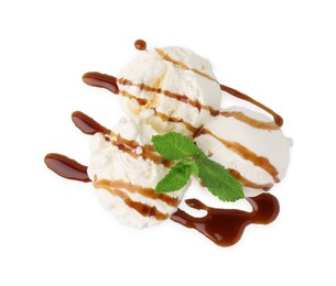 Photo of Scoopsice cream with caramel sauce and mint isolated on white, top view