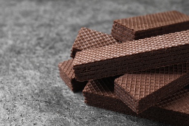 Delicious chocolate wafers on grey table, closeup