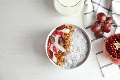 Photo of Tasty chia seed pudding served on table, flat lay. Space for text