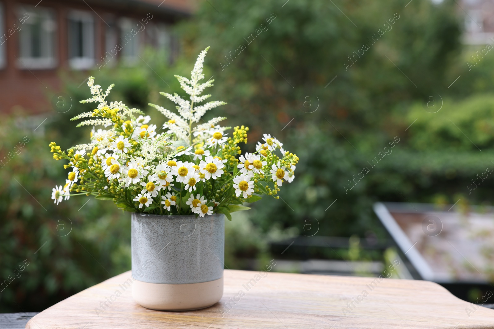 Photo of Bouquet of fresh flowers outdoors. Space for text