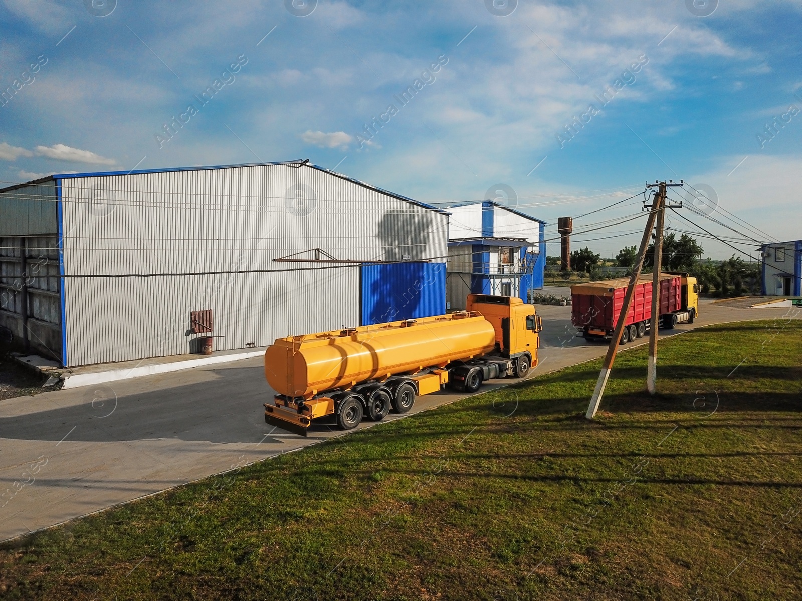 Photo of Modern bright trucks parked on country road