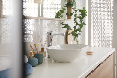 Stylish vessel sink under mirror in bathroom. Interior element