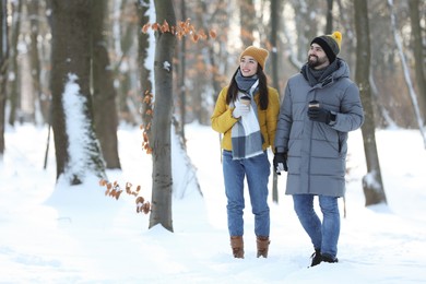 Beautiful young couple enjoying winter day outdoors