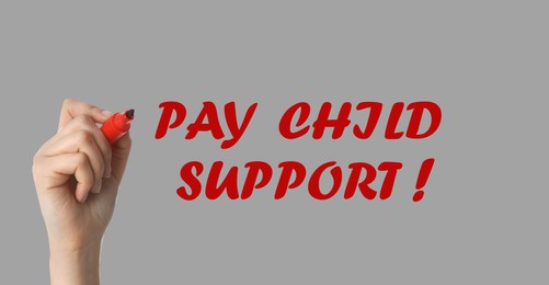 Image of Woman with marker and phrase PAY CHILD SUPPORT! on light grey background, closeup. Banner design