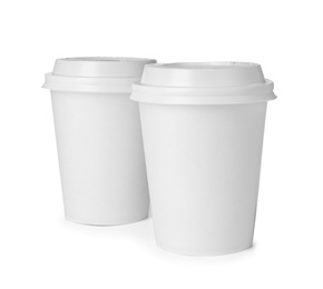 Photo of Takeaway paper coffee cups isolated on white