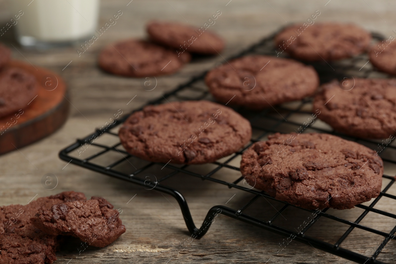 Photo of Delicious chocolate chip cookies on wooden table, closeup