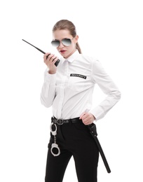 Female security guard using portable radio transmitter on white background