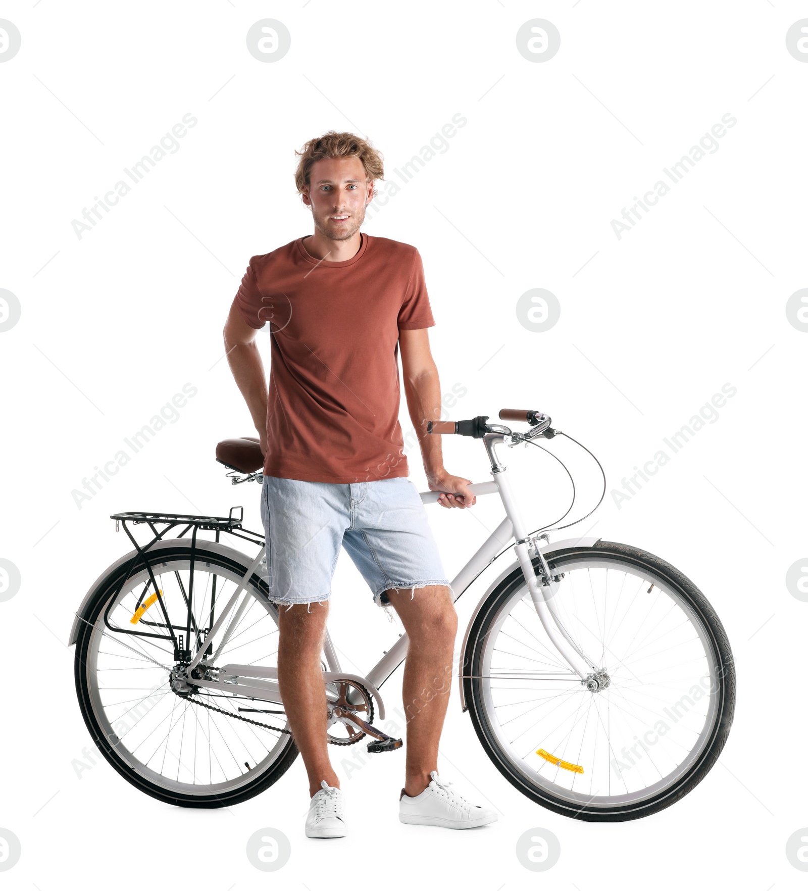 Photo of Handsome young man with bicycle on white background