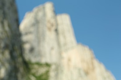 Photo of Blurred view of high mountains under sky outdoors