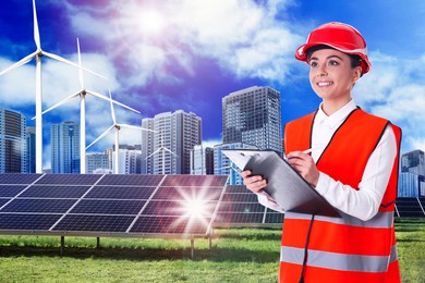 Image of Industrial engineer in uniform and view of solar panels and wind energy turbines installed outdoors