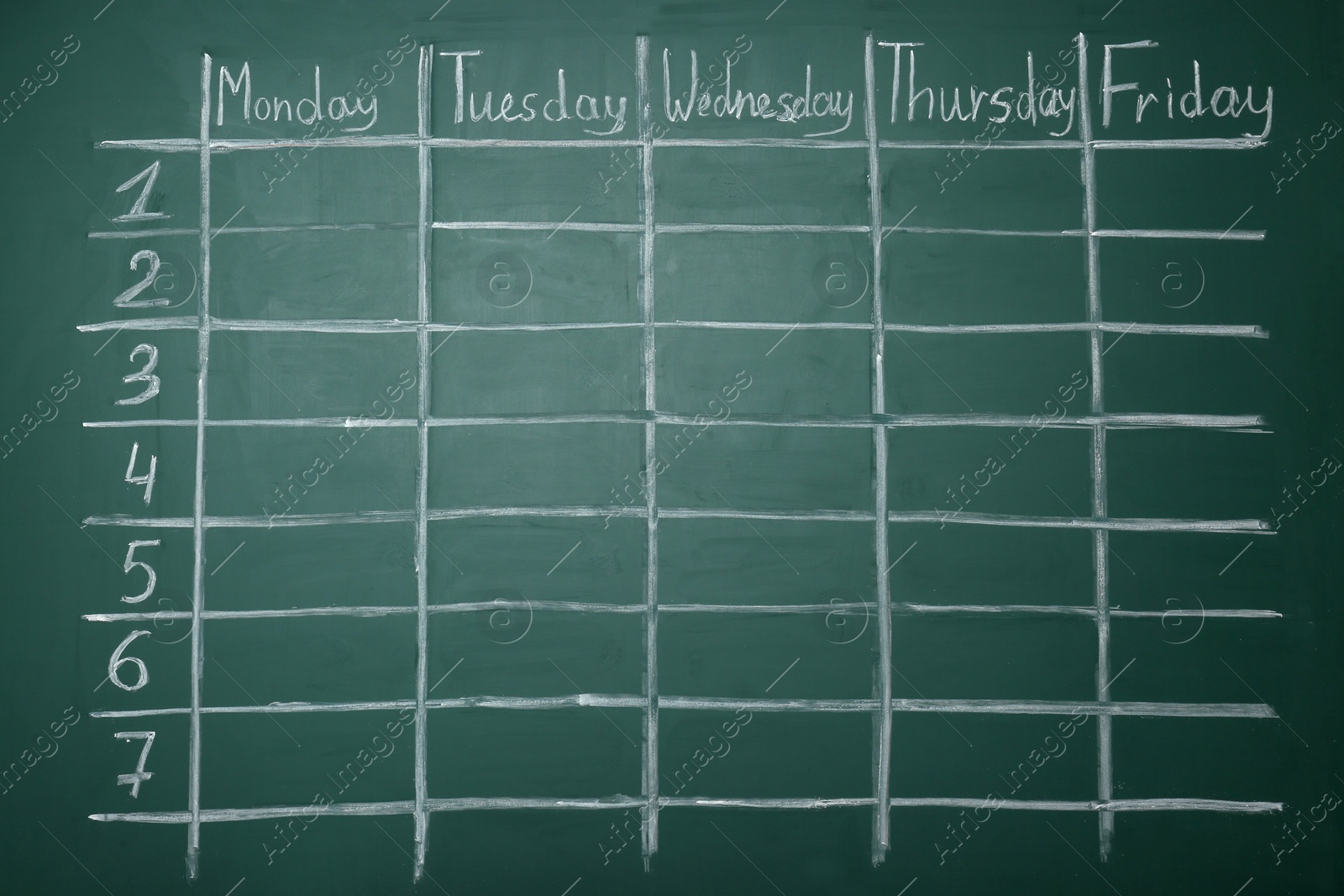 Photo of Weekly school timetable drawn on green chalkboard