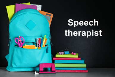 Bright backpack with school stationery and text Speech Therapist on chalkboard 