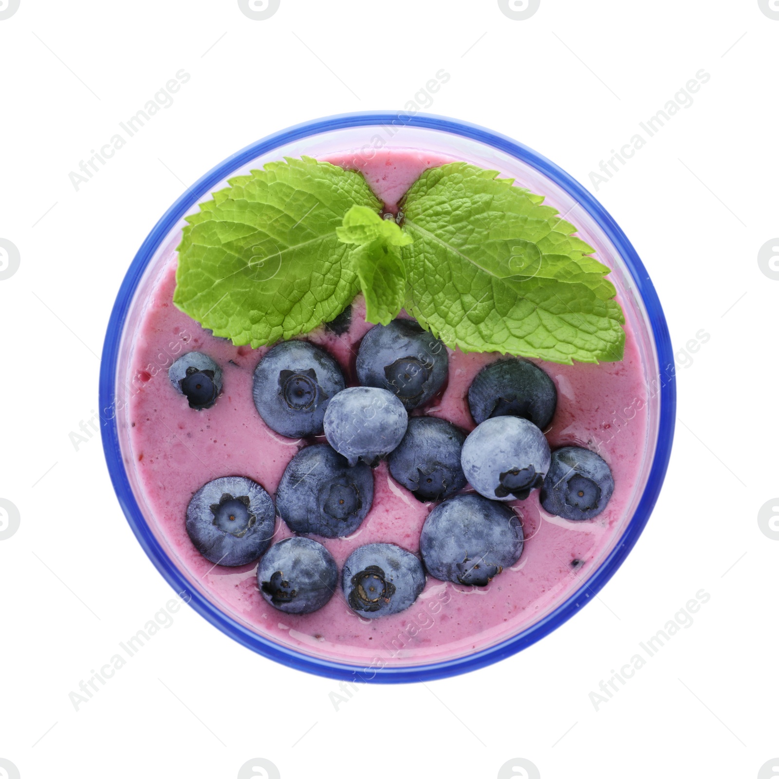 Photo of Glass of tasty blueberry smoothie with mint on white background, top view