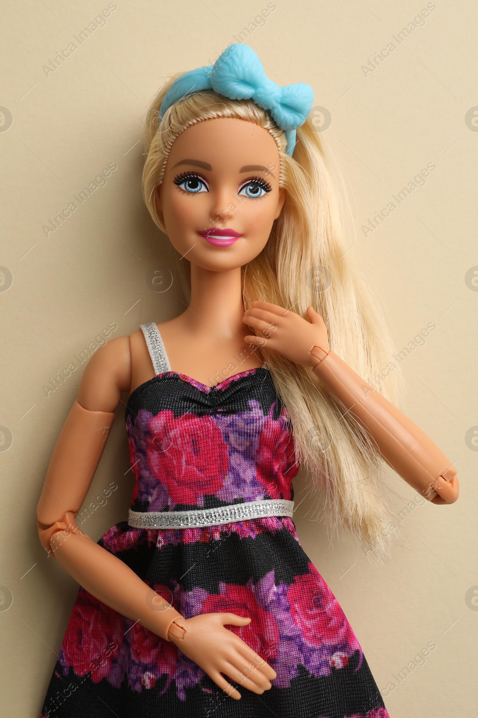 Photo of Mykolaiv, Ukraine - September 4, 2023: Beautiful Barbie doll on beige background