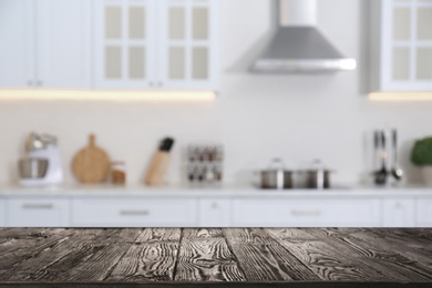 Image of Wooden table in light kitchen. Space for design