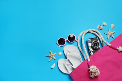 Photo of Flat lay composition with beach accessories on color background, space for text