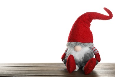 Funny Christmas gnome on wooden table against white background. Space for text