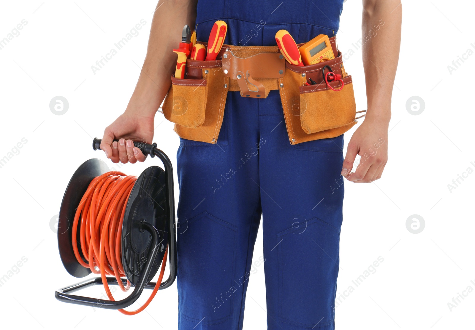 Photo of Electrician with extension cord reel and tools wearing uniform on white background, closeup