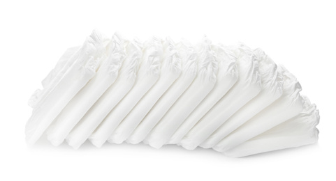 Photo of Pile of baby diapers isolated on white