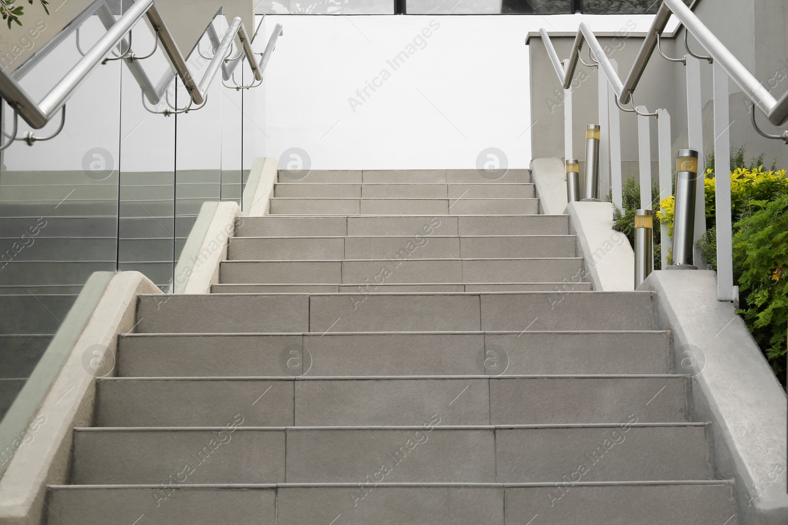 Photo of Outdoor staircase with metal handrails on city street