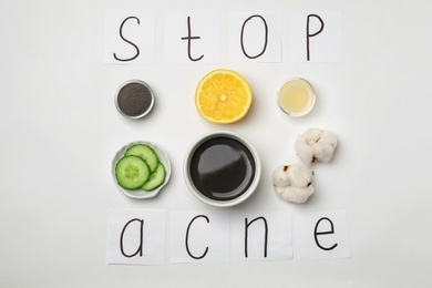 Photo of Phrase "Stop acne" and homemade effective problem skin remedy on white background