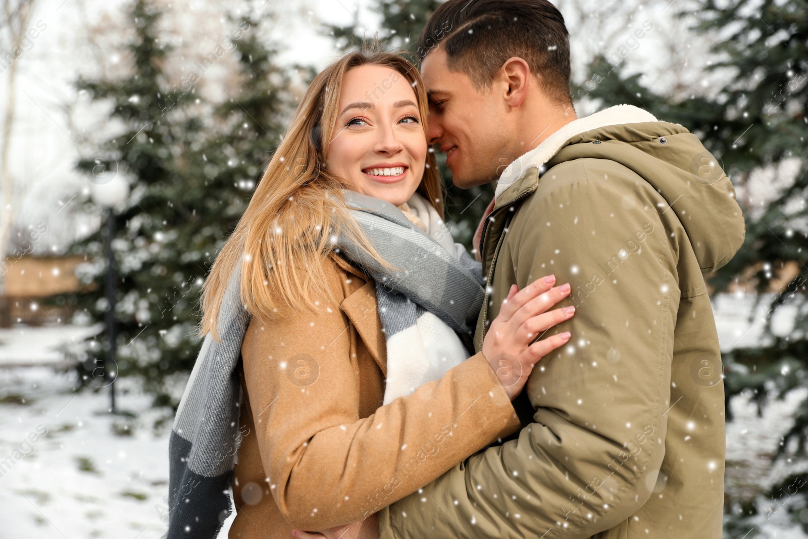 Photo of Beautiful happy couple outdoors on winter day