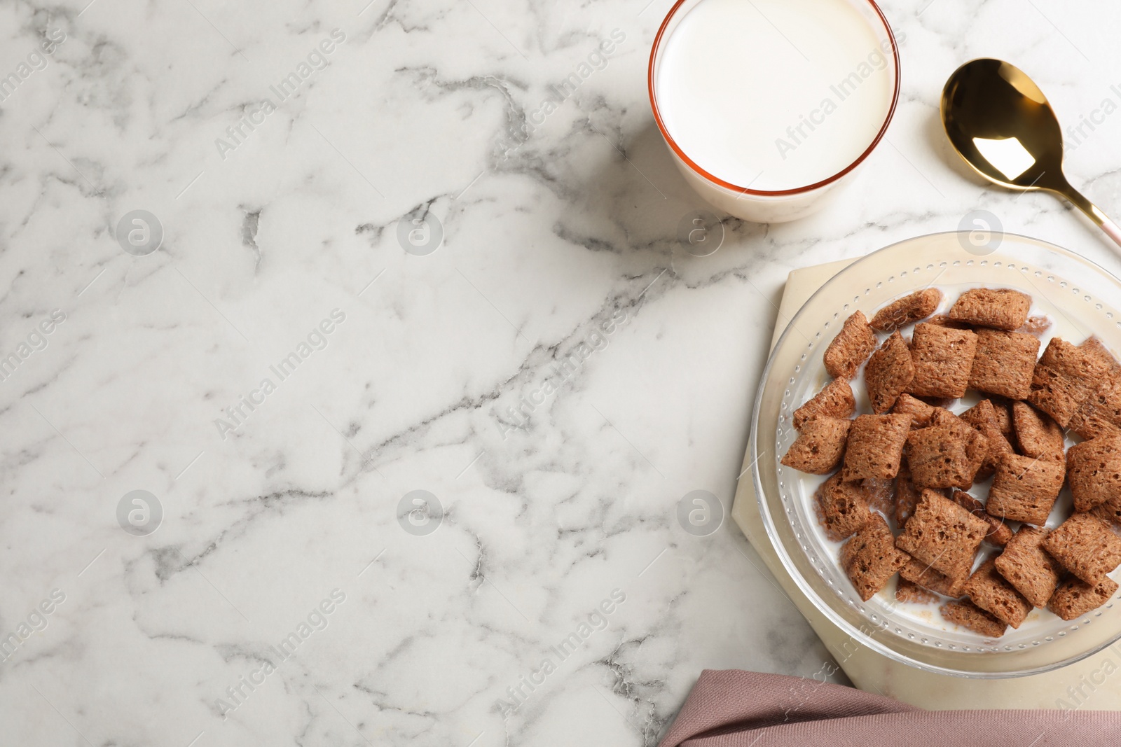 Photo of Tasty corn pads with milk served on white marble table, flat lay. Space for text