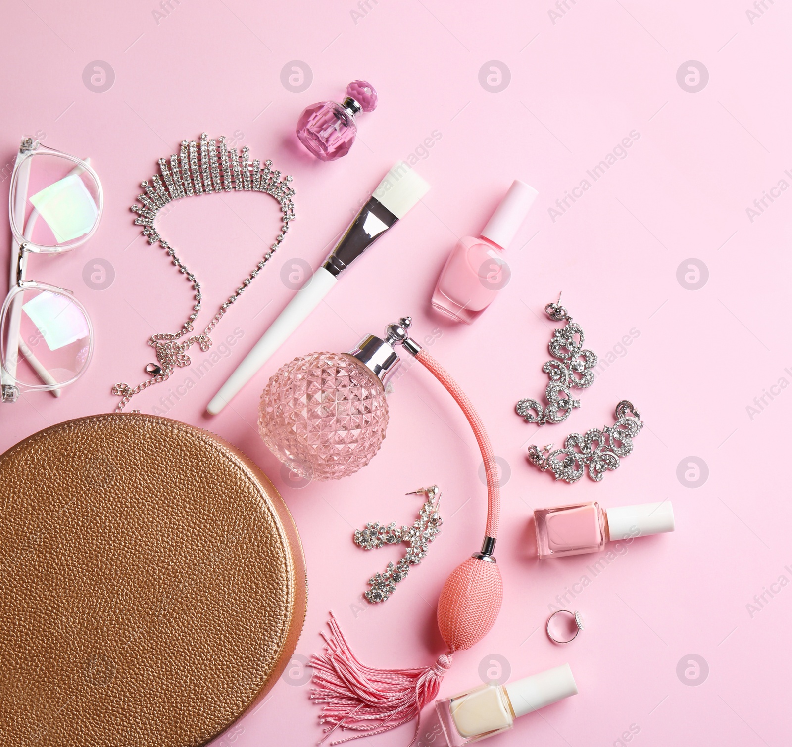 Photo of Composition with perfume bottles, cosmetics and jewellery on color background, flat lay