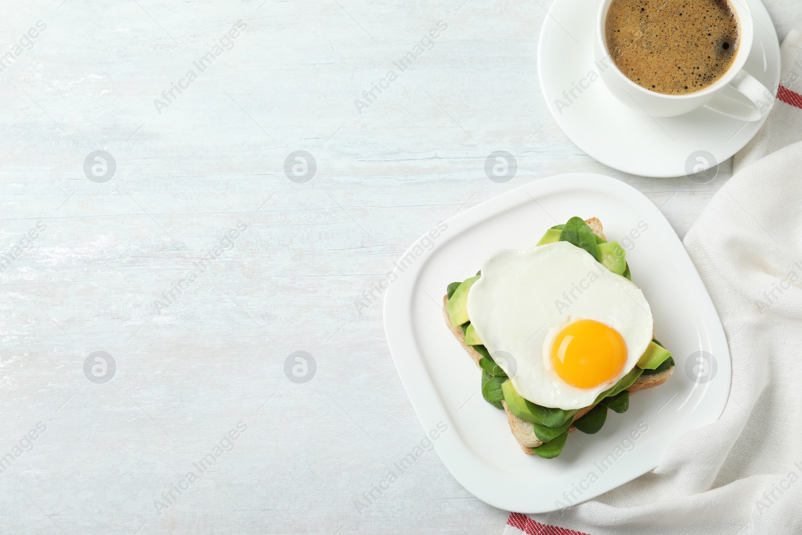 Photo of Delicious breakfast with fried egg served on table, flat lay. Space for text