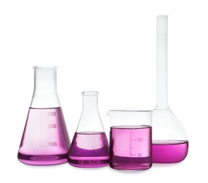 Photo of Laboratory glassware with purple liquid on white background