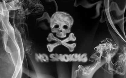 Image of No Smoking. Skull and crossbones symbol over phrase of smoke on black background