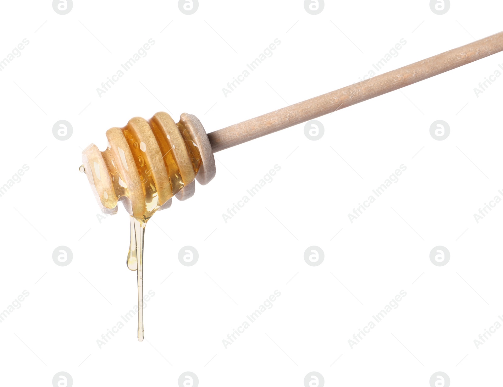 Photo of Fresh honey dripping from dipper on white background