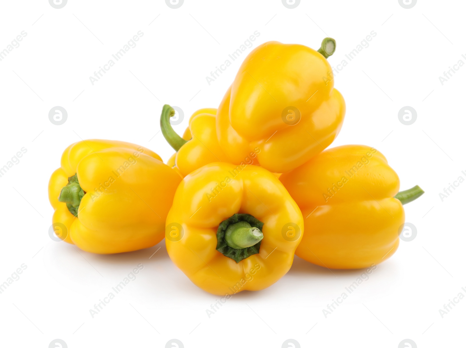 Photo of Ripe yellow bell peppers isolated on white