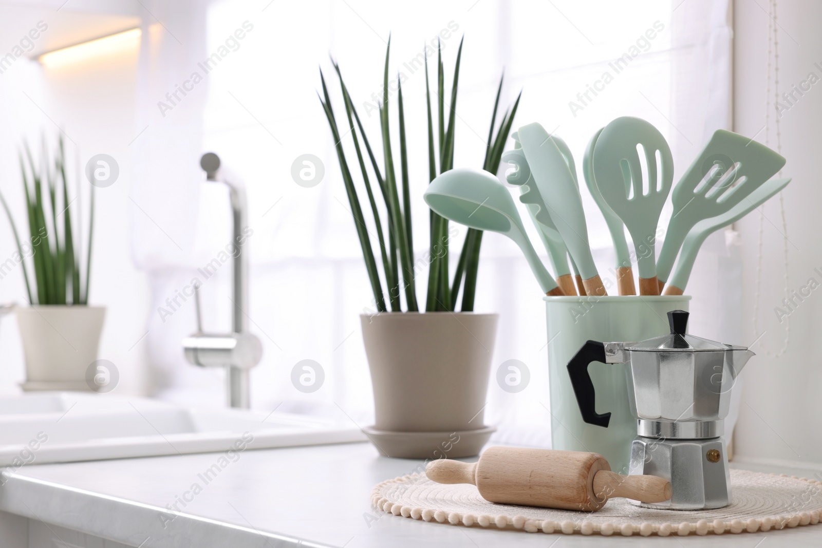 Photo of Set of different utensils on countertop in kitchen, space for text