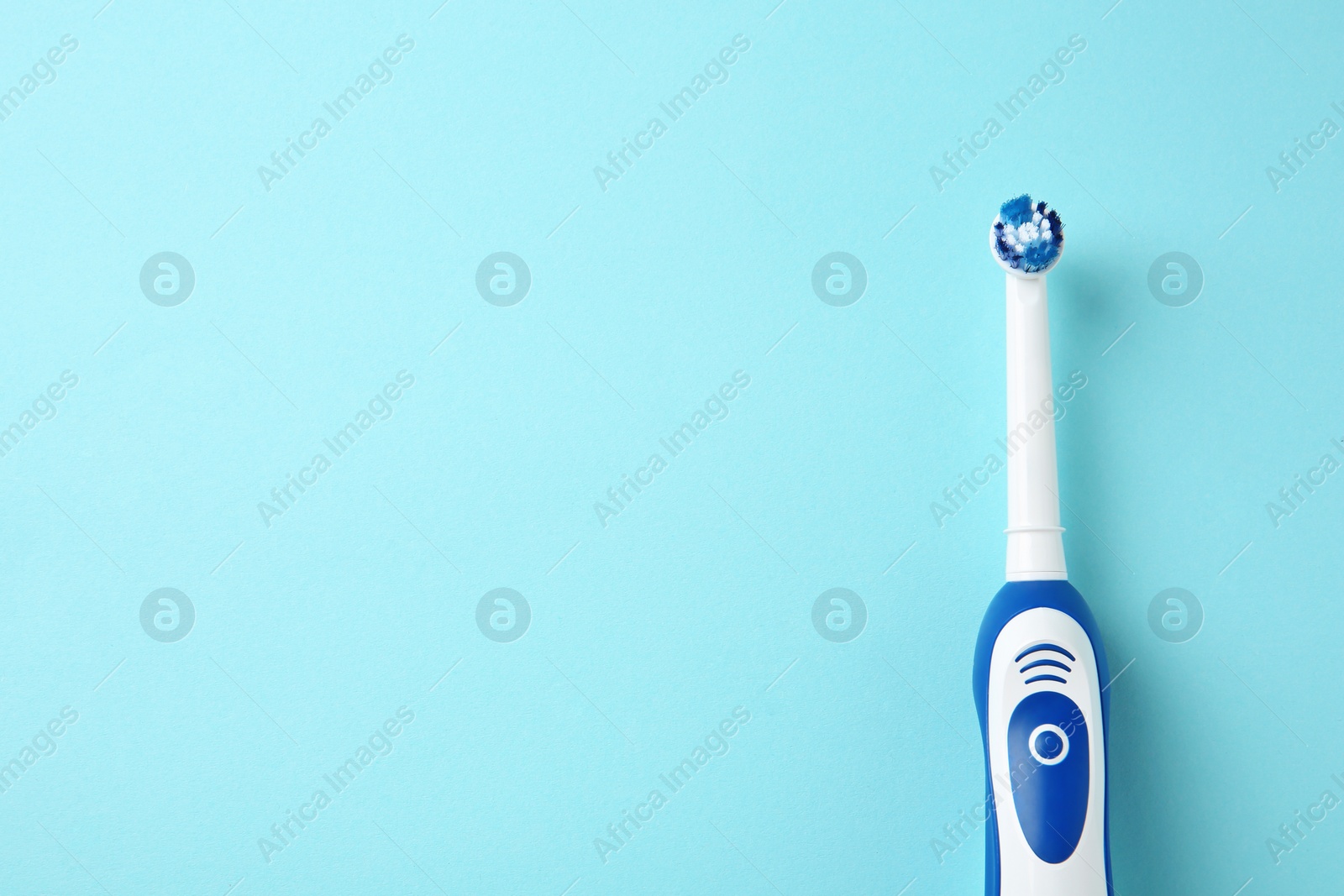 Photo of Electric toothbrush on color background. Dental care