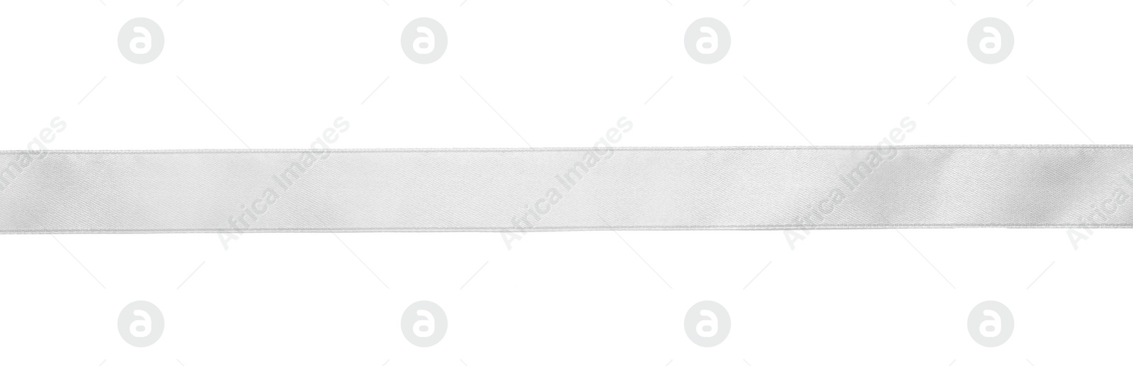 Photo of Beautiful silver ribbon isolated on white, top view