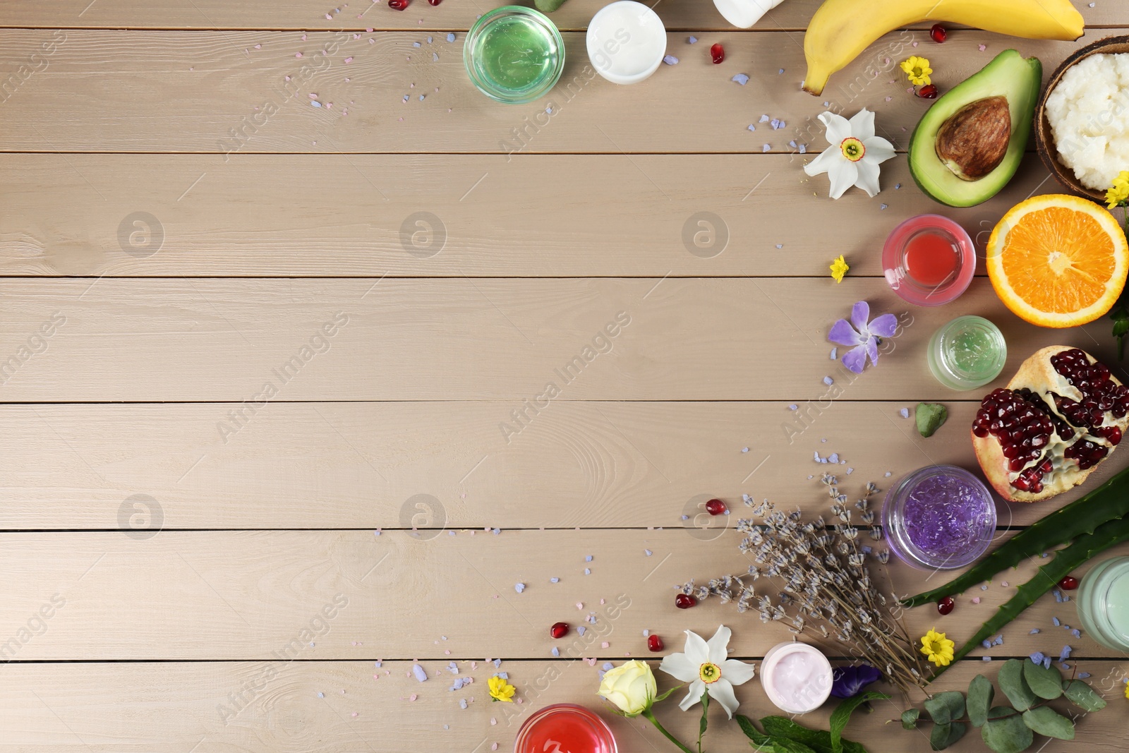 Photo of Flat lay composition with homemade cosmetic products and fresh ingredients on wooden table., space for text. DIY beauty recipe