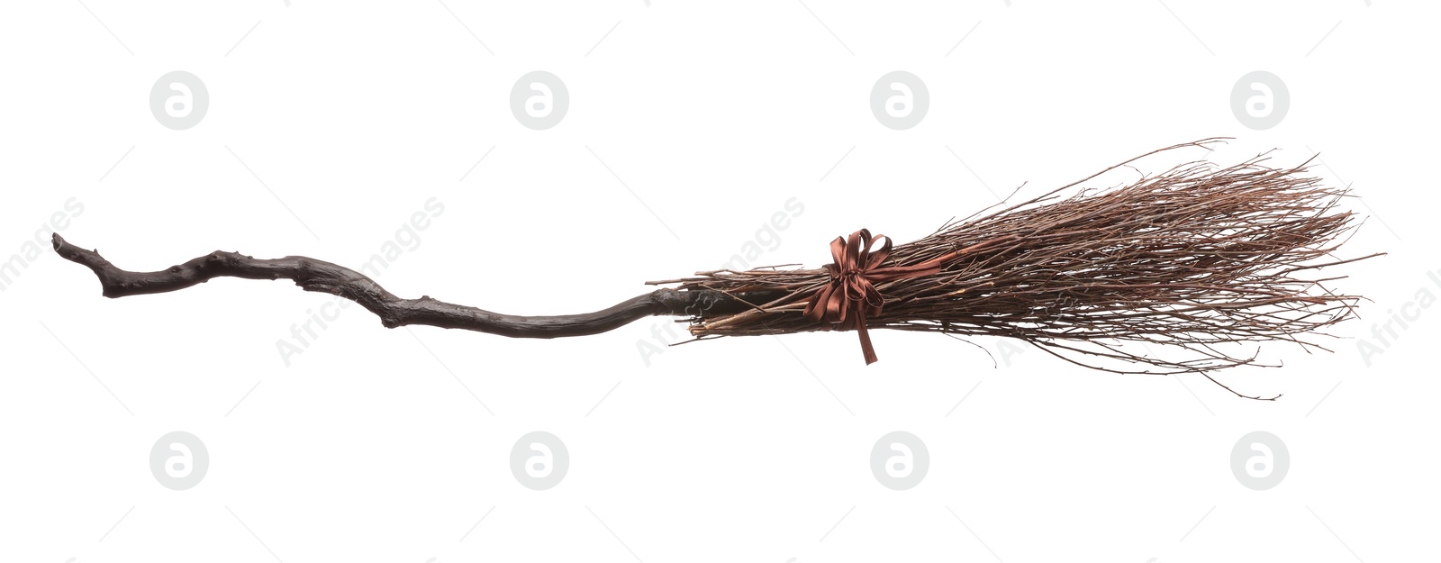 Photo of Old broom with wooden handle isolated on white