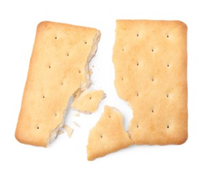 Photo of Crispy broken cracker isolated on white, top view