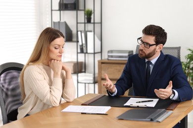 Photo of Woman having meeting with lawyer in office