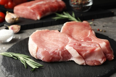 Photo of Fresh raw cut meat on slate plate