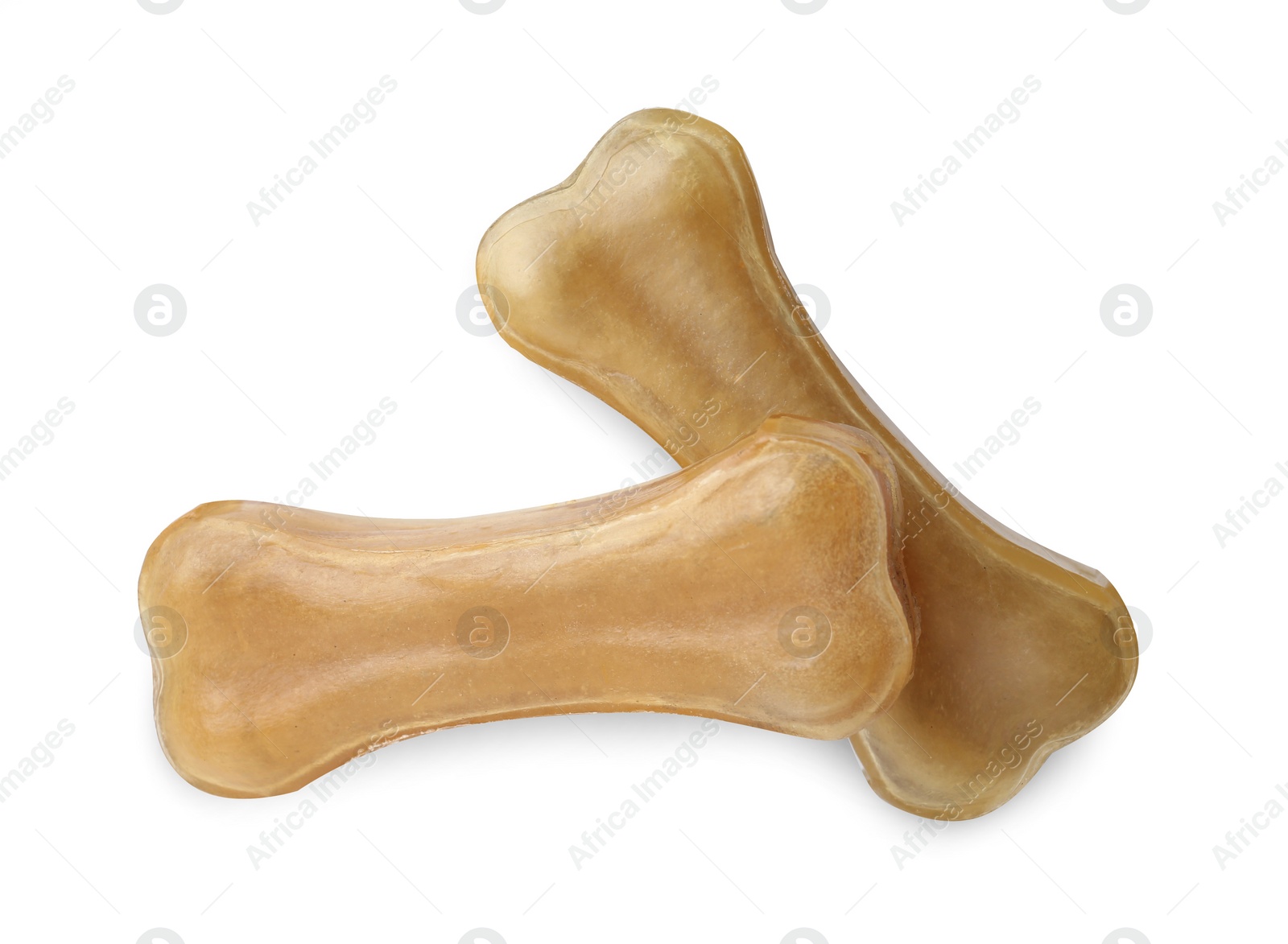 Photo of Chew bones for dog isolated on white, top view. Pet toys