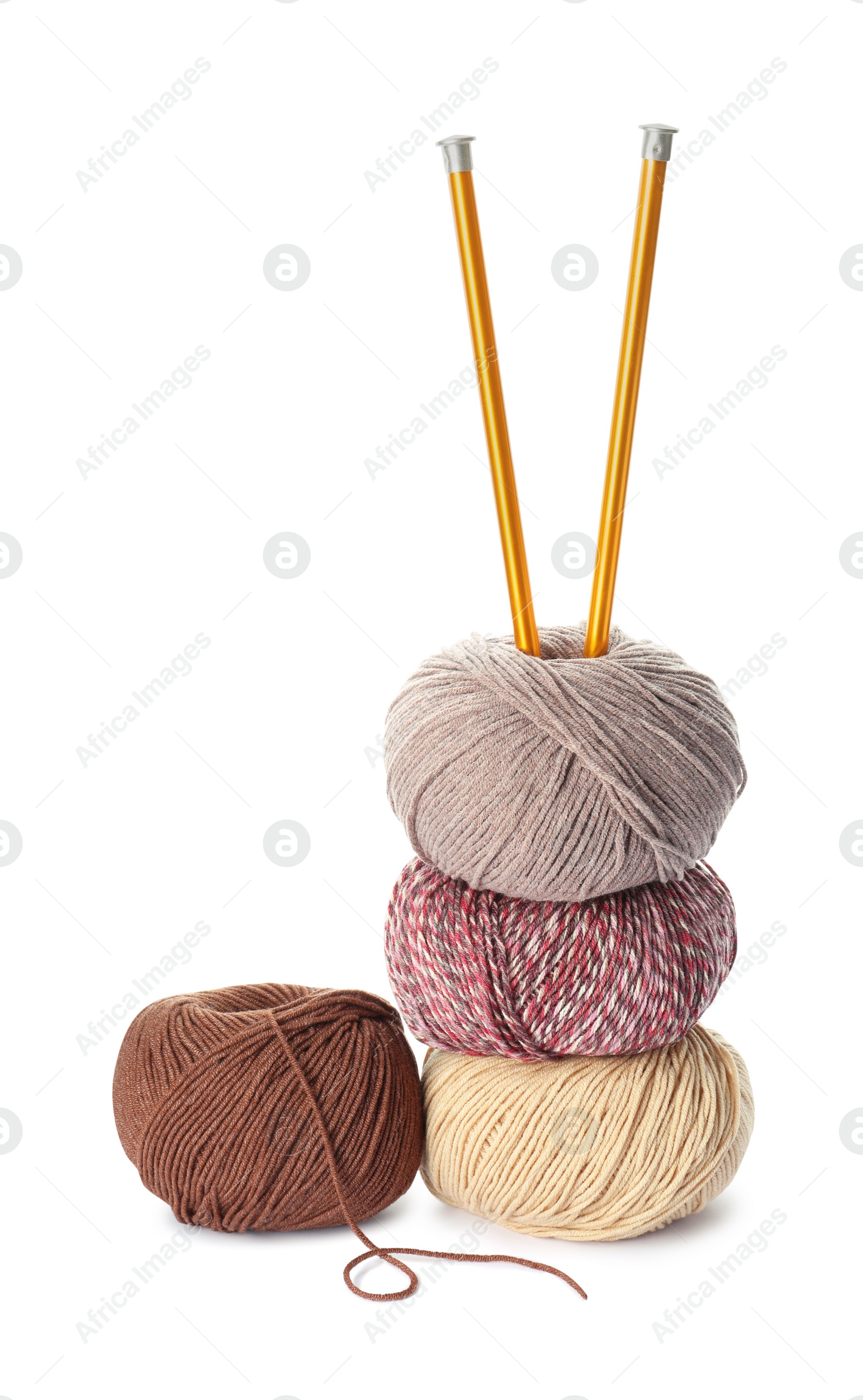 Photo of Different balls of woolen knitting yarns and needles on white background