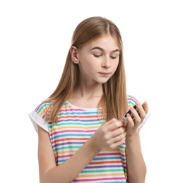 Photo of Teen girl using glucometer on white background. Diabetes control