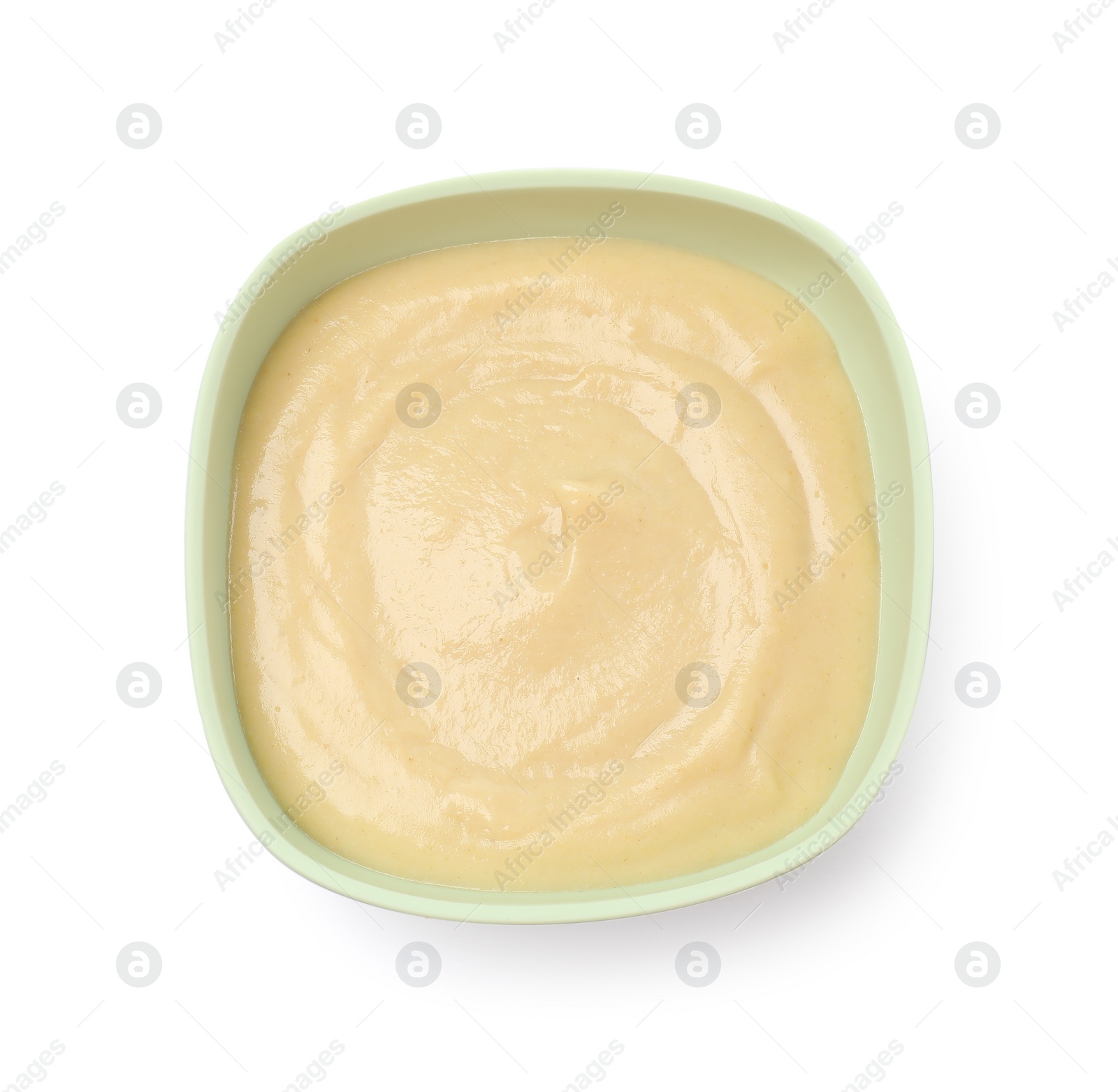 Photo of Tasty baby food in bowl isolated on white, top view